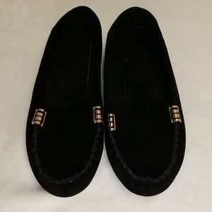 Black loafers with bronze detailing
